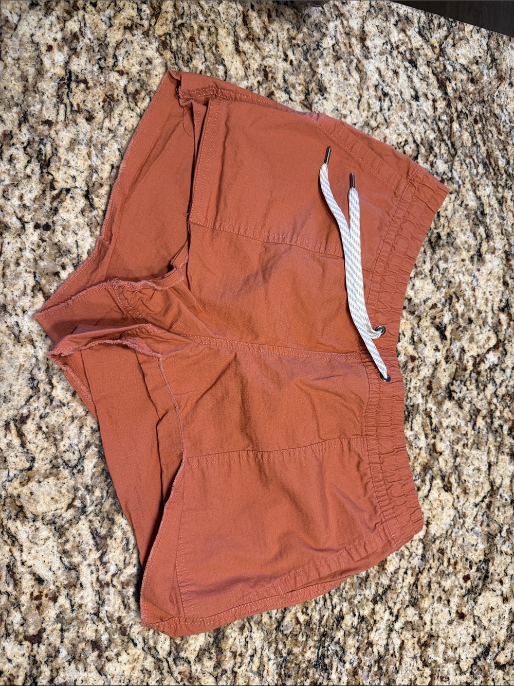 Vuori women’s Rust-Orange Athletic Drawstring Shorts